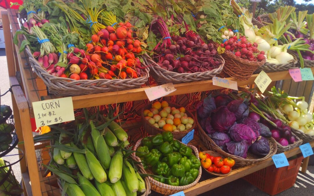 Baskets of vegetables for sale at a farmers market